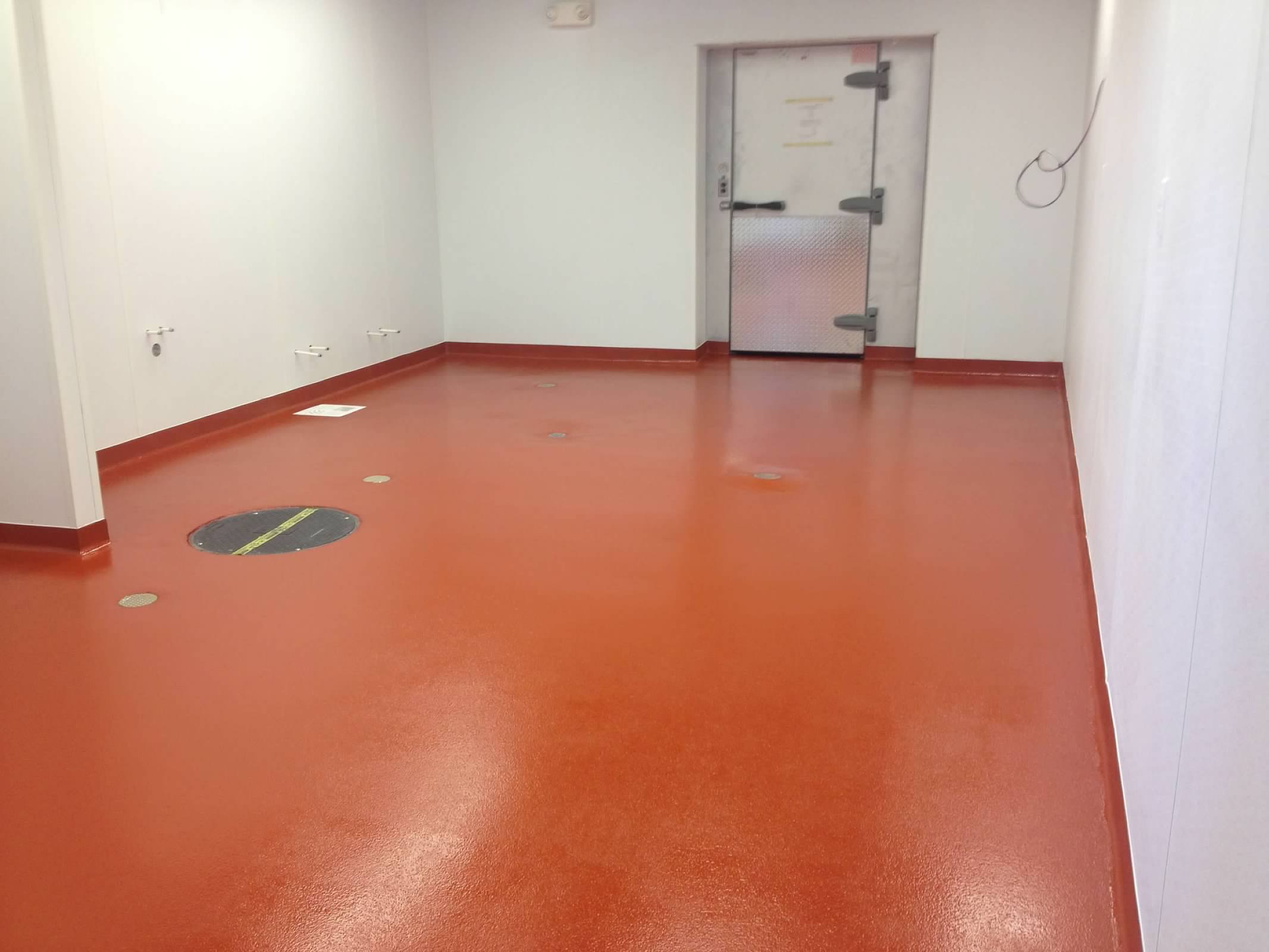 Coated red floor with a large freezer door