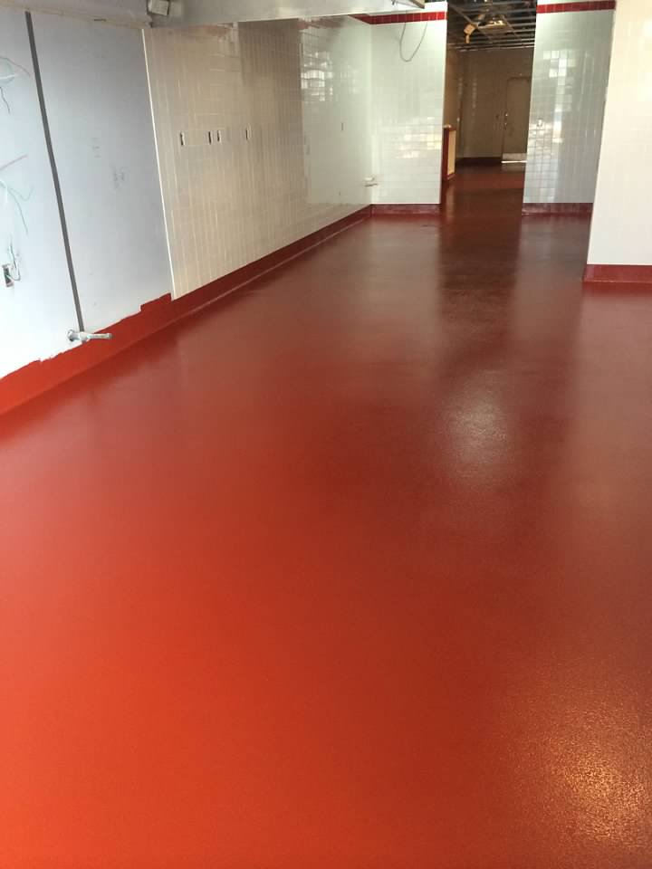 Coated red floor in an empty room