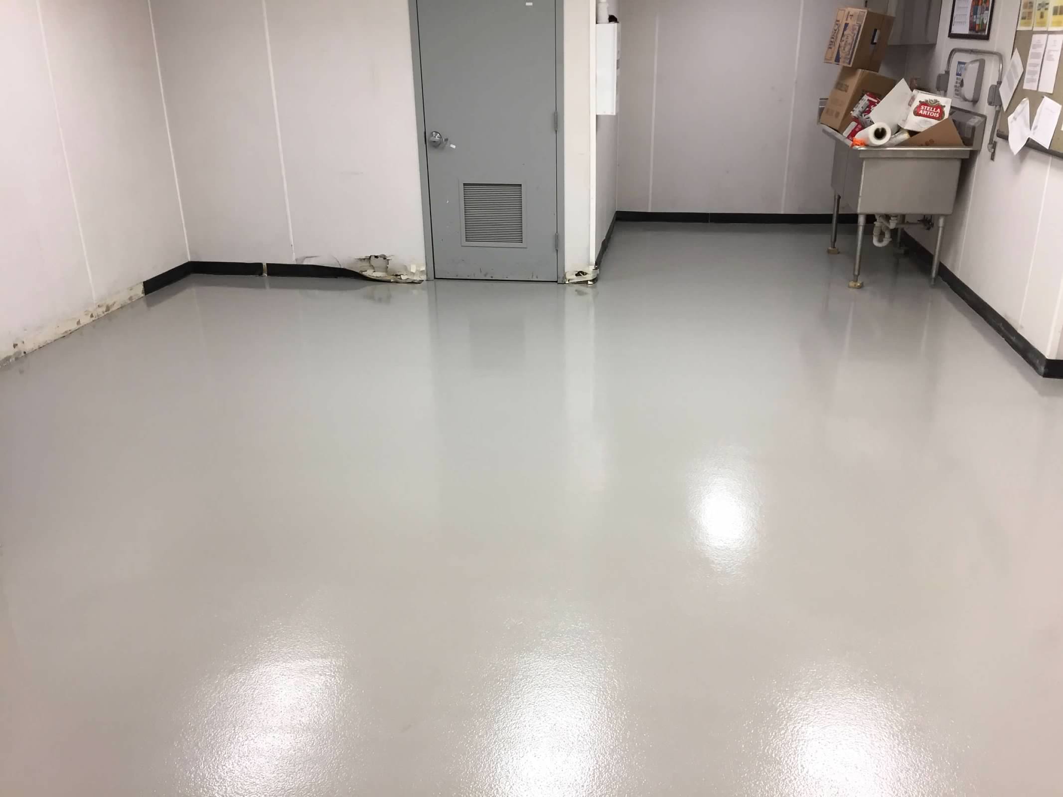 Coated floor with a sink in the background