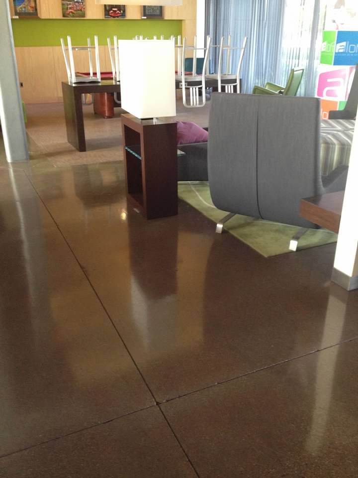 Stained floor with chairs and tables in the background